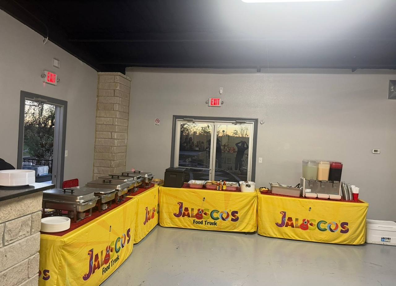 Indoor venue catering setup with chafing dishes and aguas frescas by Jalisco Food Truck