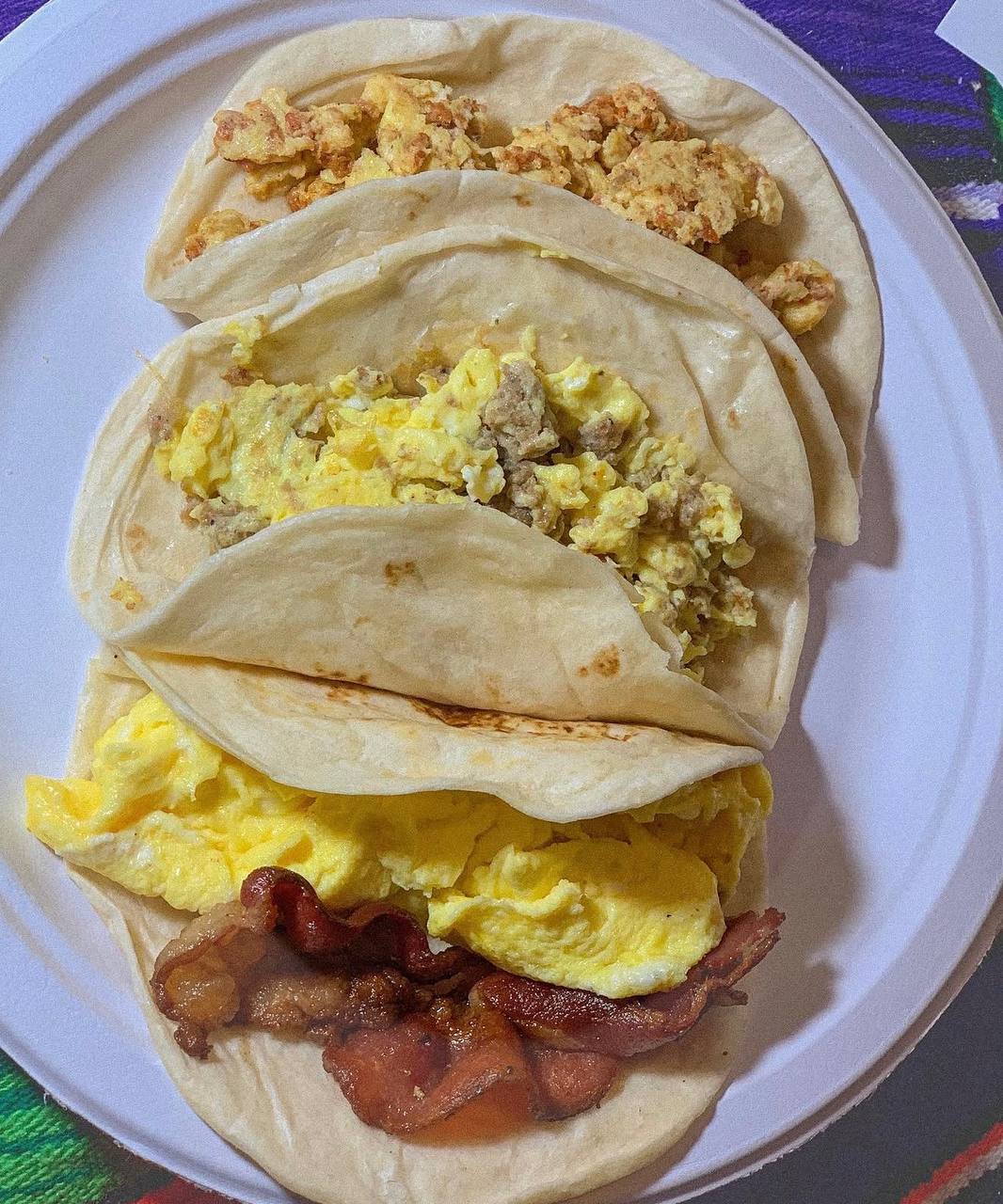 Breakfast tacos with scrambled eggs chorizo and bacon at Jalisco Food Truck Bastrop TX