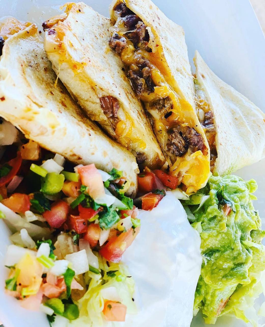 Quesadilla plate with pico guacamole and sour cream at Jalisco Food Truck Bastrop TX